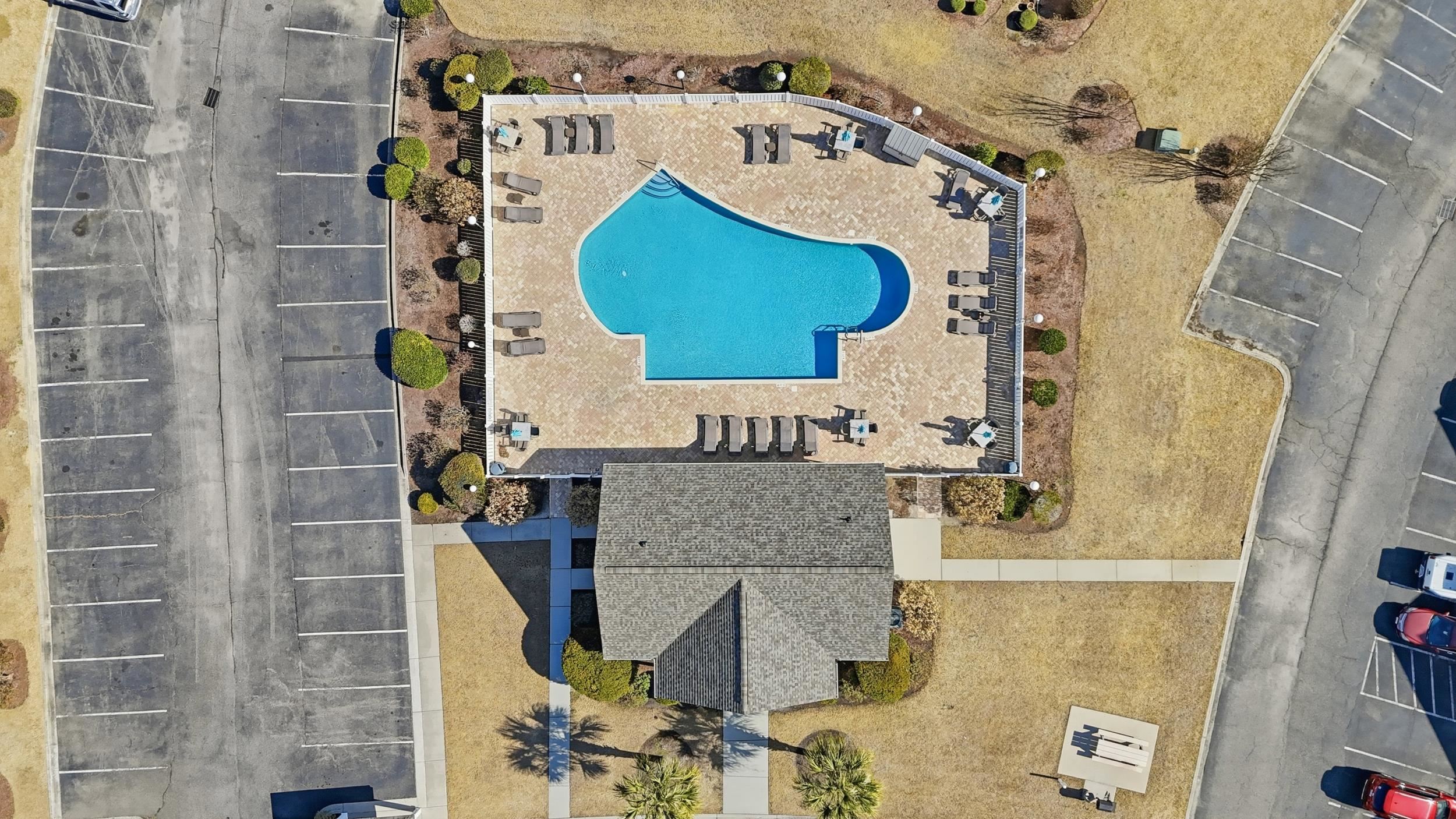 5870 Longwood Drive, Unit 203 Murrells Inlet, SC 29576 - Photo 28 of 32 Aerial view of a pool