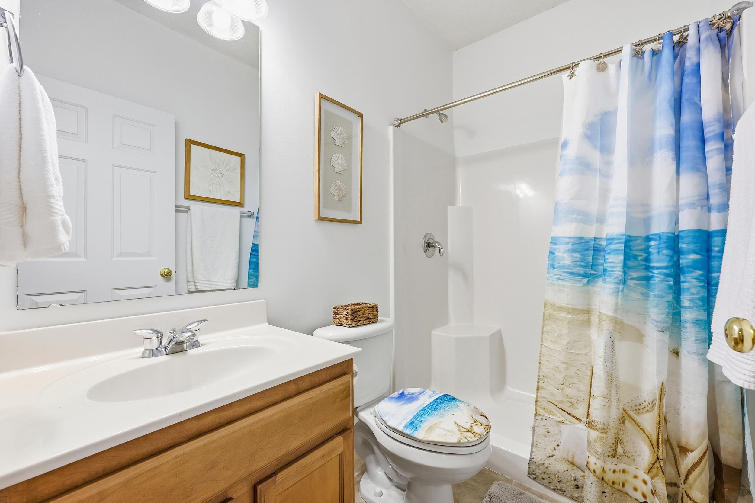 5870 Longwood Drive, Unit 203 Murrells Inlet, SC 29576 - Photo 9 of 32 Bathroom with curtained shower and vanity