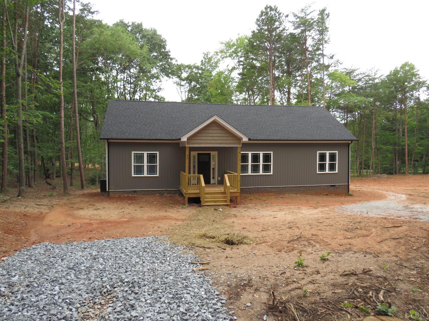 40 Hawkins Road Evington, VA 24550 - Photo 1 of 14 a front view of a house with yard porch and tree
