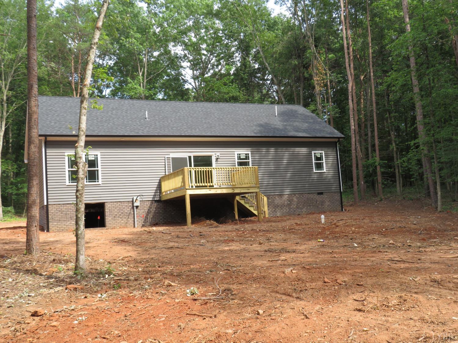 40 Hawkins Road Evington, VA 24550 - Photo 3 of 14 a front view of a house with a yard and garage