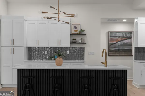 a kitchen with a sink and cabinets
