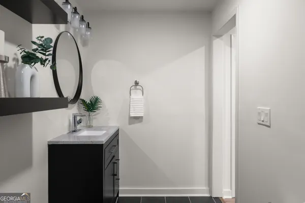 a bathroom with a sink and a mirror