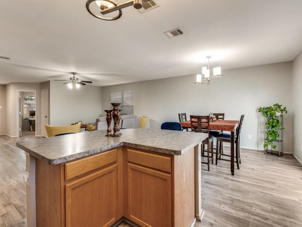 147 Washington Way Venus, TX 76084 - Photo 12 of 24 a kitchen with a table and chairs in it