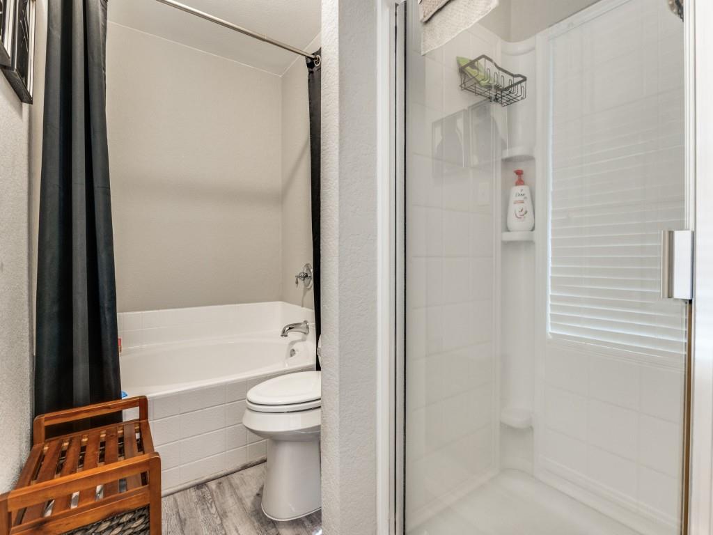 147 Washington Way Venus, TX 76084 - Photo 17 of 24 a bathroom with a toilet and a shower