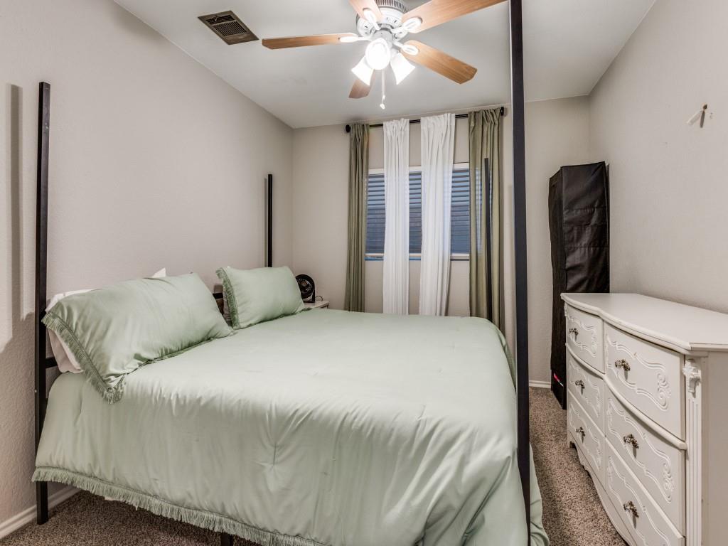 147 Washington Way Venus, TX 76084 - Photo 18 of 24 a spacious bedroom with a bed and a chandelier