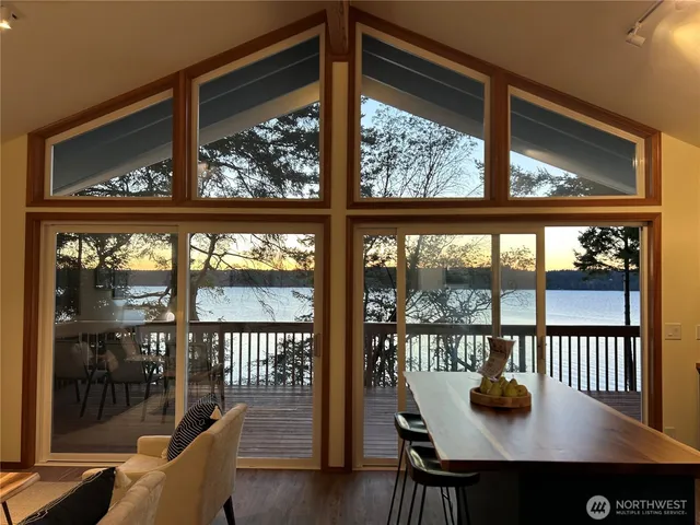 a view of a city from a room with furniture