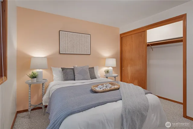 a bed room with a bed and a lamp