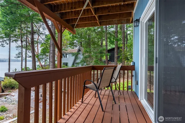 a view of balcony with wooden floor and outdoor space