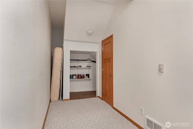 a view of a kitchen with refrigerator