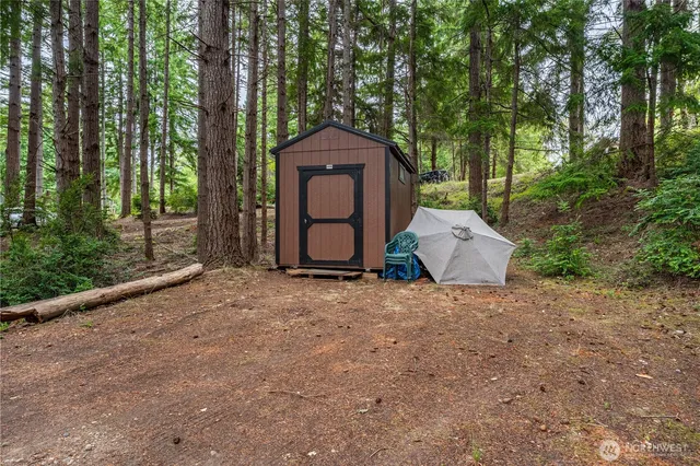 a backyard of a house with a garden and deck