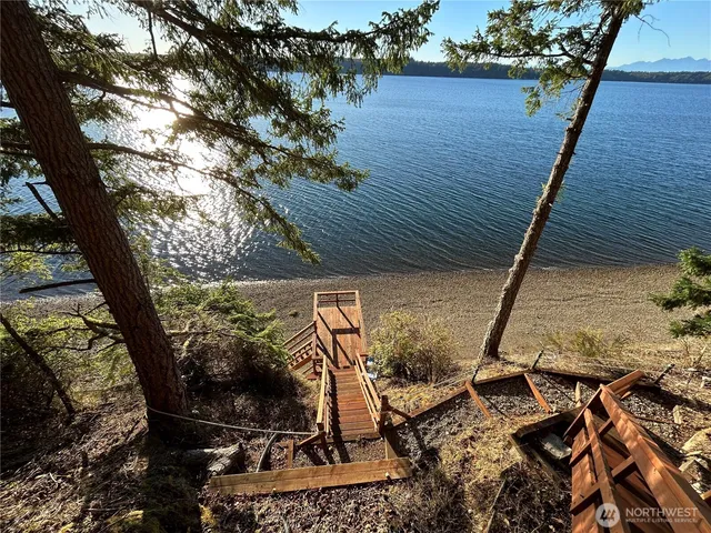 a view of a backyard with sitting area