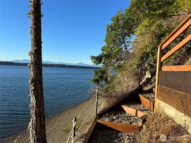 a view of a balcony with two trees