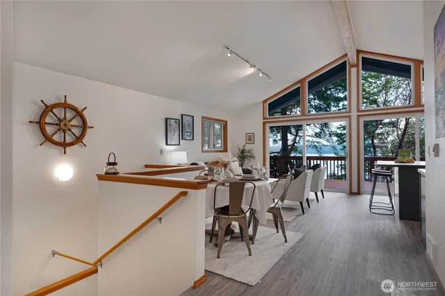 a view of a dining room with furniture window and wooden floor