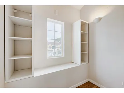 a view of an empty room with a window