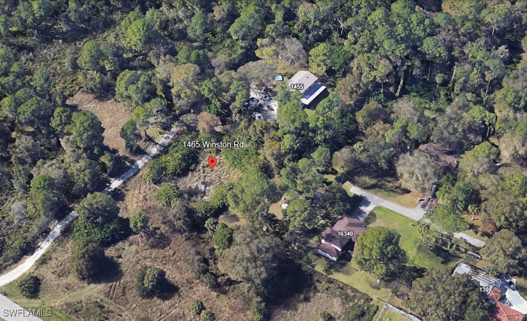 1465 Winston Road North Fort Myers, FL 33917 - Photo 2 of 4 a view of a yard with plants
