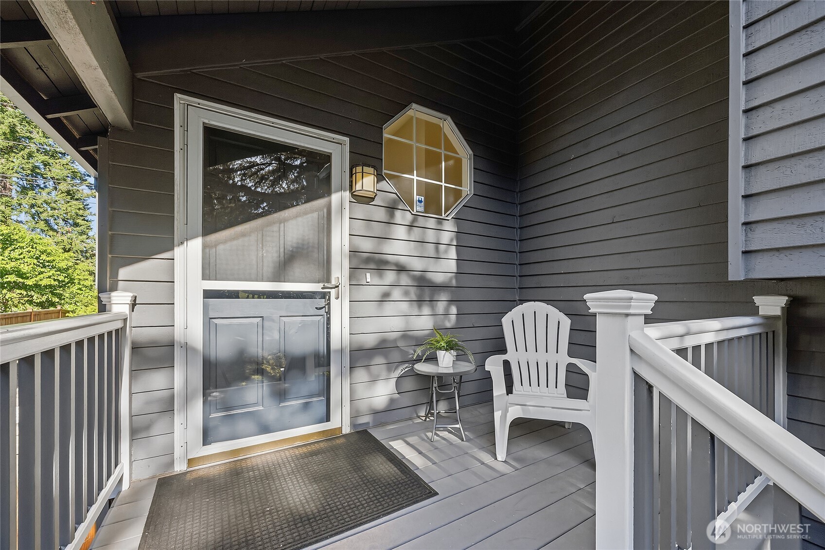23707 Meridian Place West Bothell, WA 98021 - Photo 2 of 40 a view of roof deck with chair and glass door