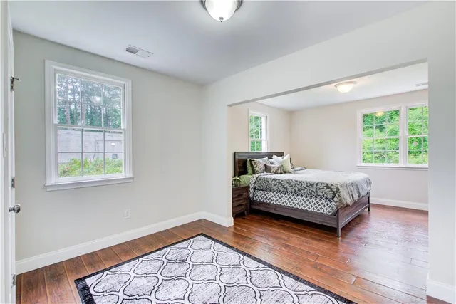 a bedroom with a bed and window