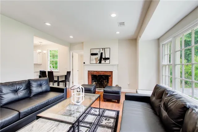 a kitchen with stainless steel appliances granite countertop a refrigerator and a stove