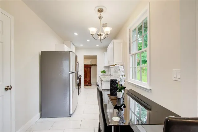 a kitchen with a sink and a stove top oven