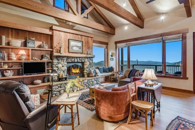 a living room with fireplace furniture and a flat screen tv