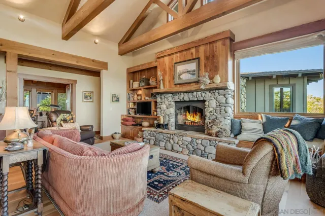 a lobby with furniture and floor to ceiling window