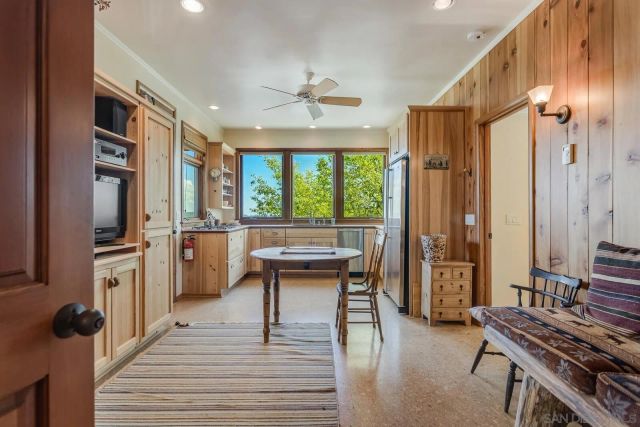 a view of balcony with wooden floor and fence