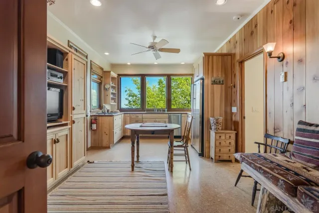a view of balcony with wooden floor and fence