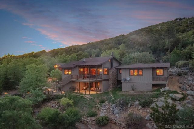 a view of a large yard with lots of trees