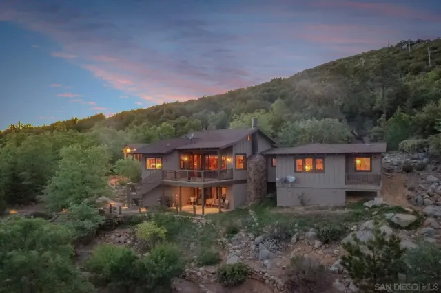 a view of a large yard with lots of trees