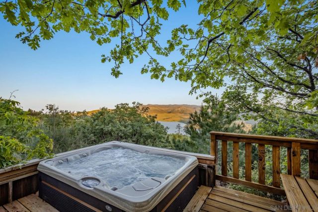 a view of a backyard with plants and a patio