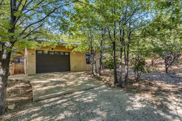 a house with a tree in front of it