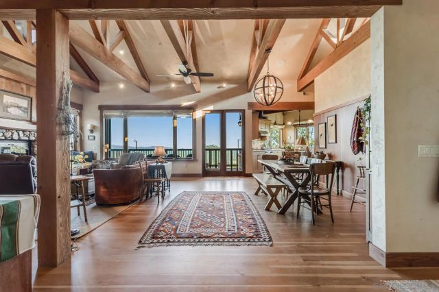 a living room with fireplace furniture and a flat screen tv