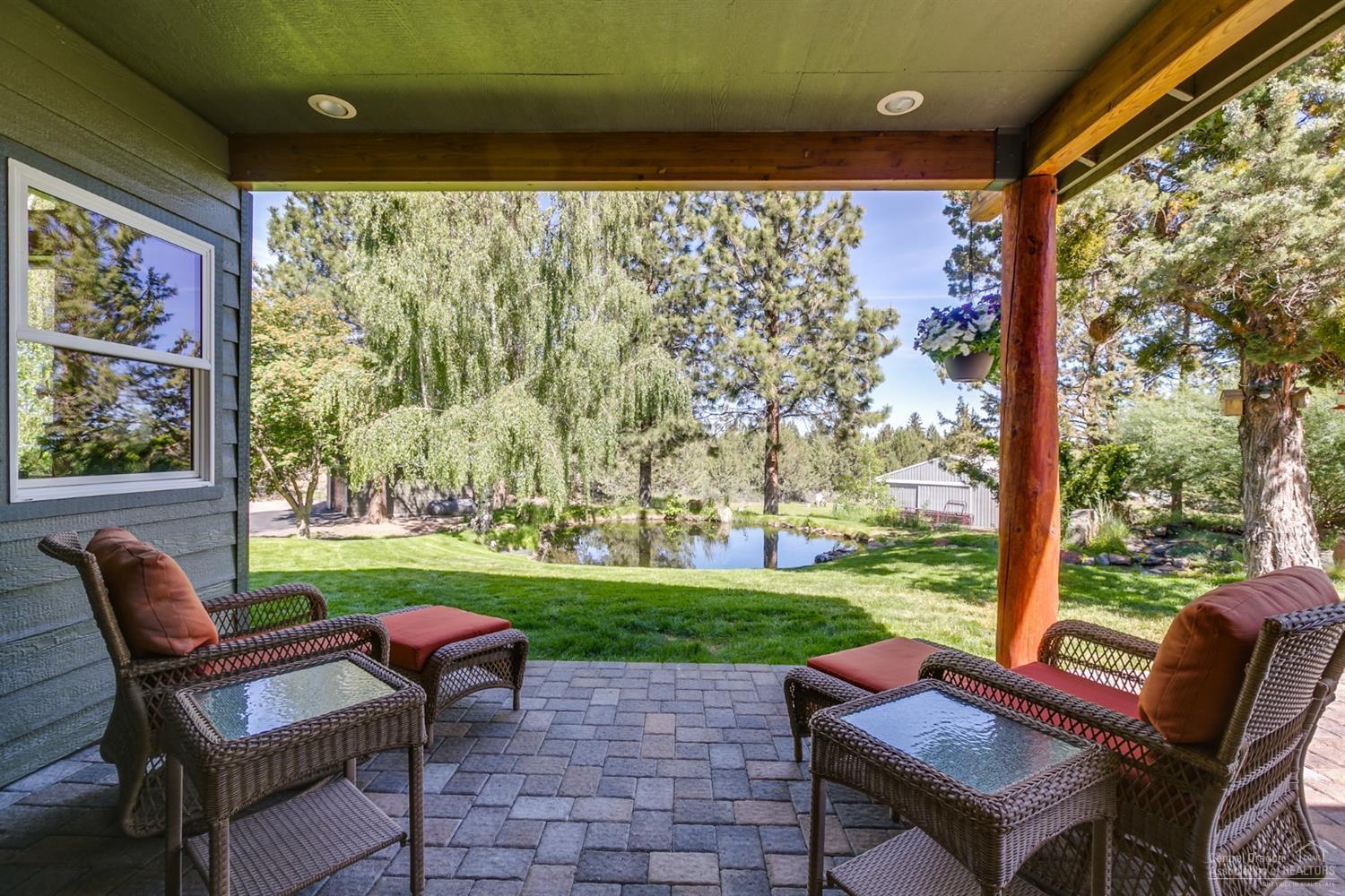 21210 Yeoman Road Bend, OR 97701 - Photo 3 of 25 a view of a patio with chair and table