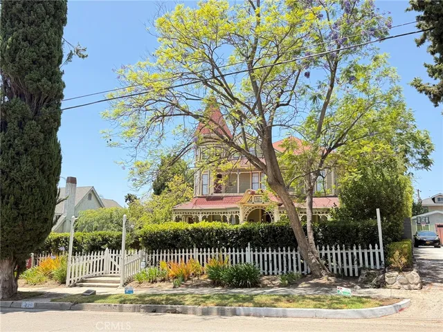 a view of a house with a garden and pathway