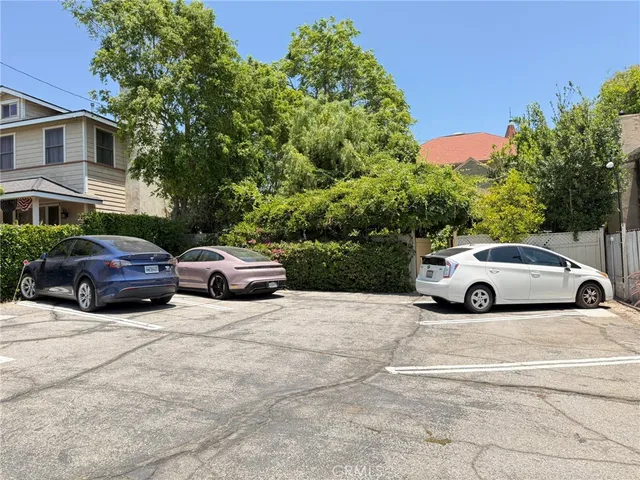 a view of a cars parked in front of a house