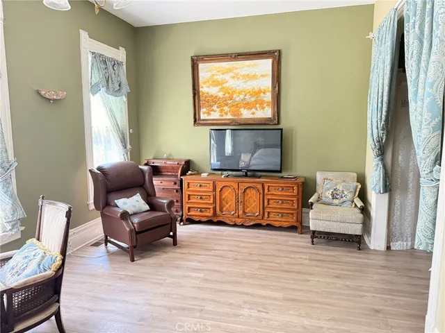 a living room with furniture and a window