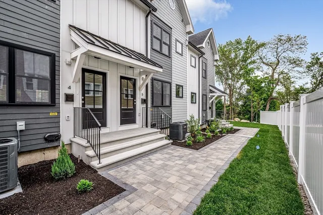 a view of a house with backyard sitting area and garden