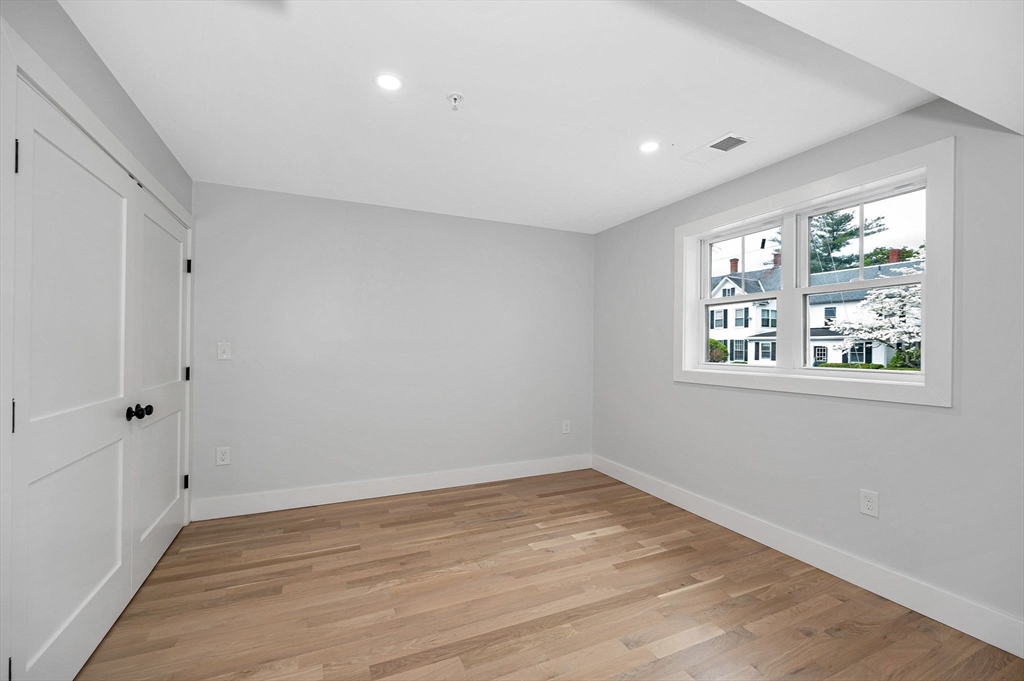 1514 Gorham Street, Unit 4 Lowell, MA 01852 - Photo 15 of 42 wooden floor in an empty room with a window