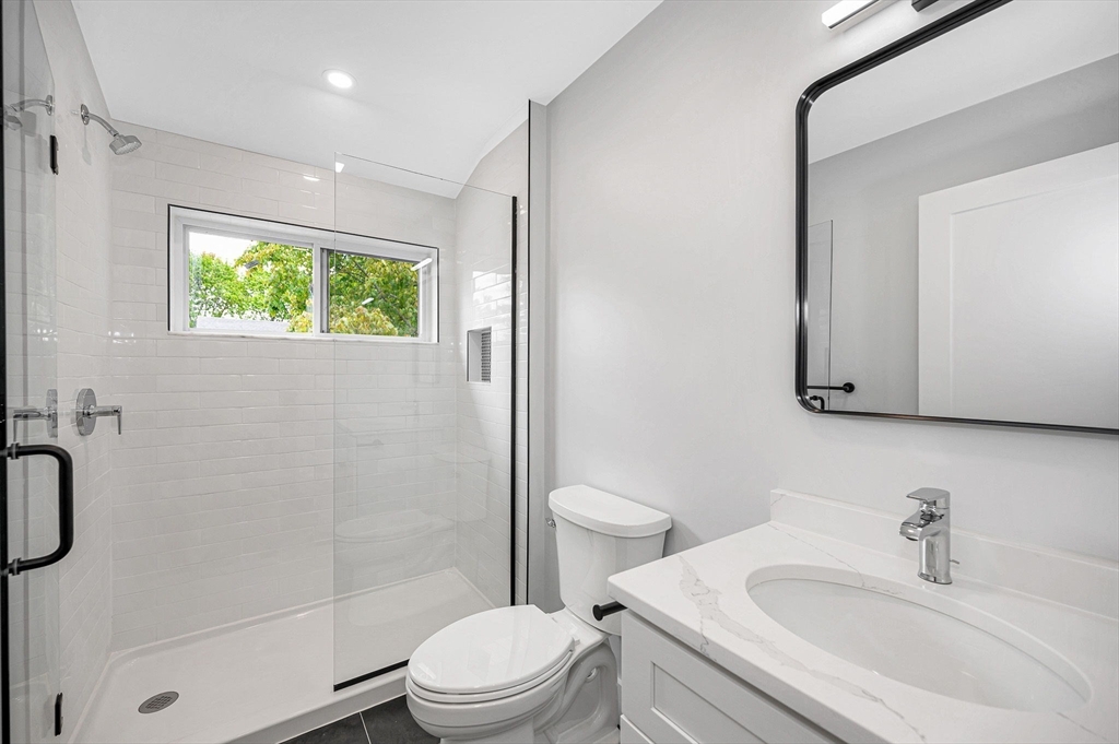 1514 Gorham Street, Unit 4 Lowell, MA 01852 - Photo 21 of 42 a bathroom with a sink toilet and shower