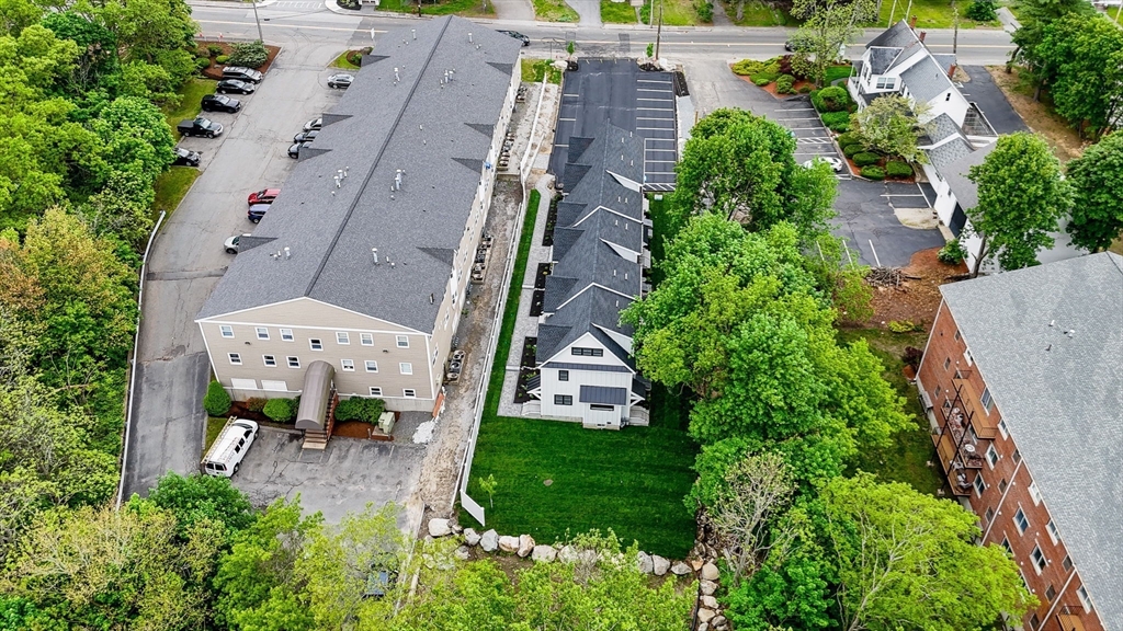 1514 Gorham Street, Unit 4 Lowell, MA 01852 - Photo 33 of 42 an aerial view of multiple houses with yard