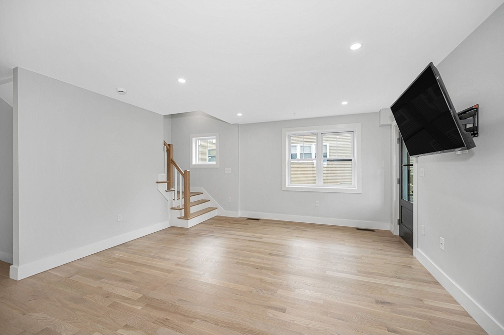 1514 Gorham Street, Unit 4 Lowell, MA 01852 - Photo 4 of 42 wooden floor in an empty room with a window