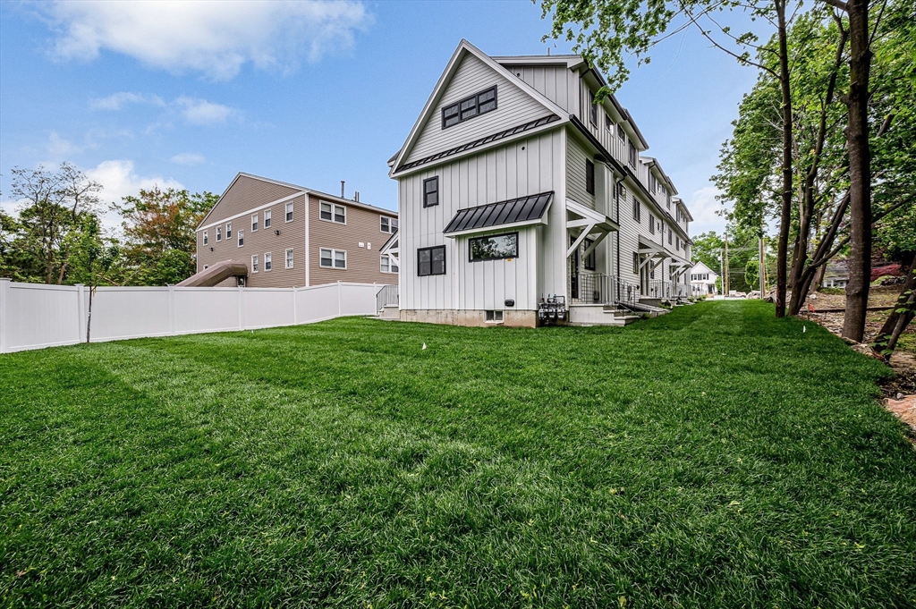 1514 Gorham Street, Unit 4 Lowell, MA 01852 - Photo 41 of 42 a front view of house with yard and green space