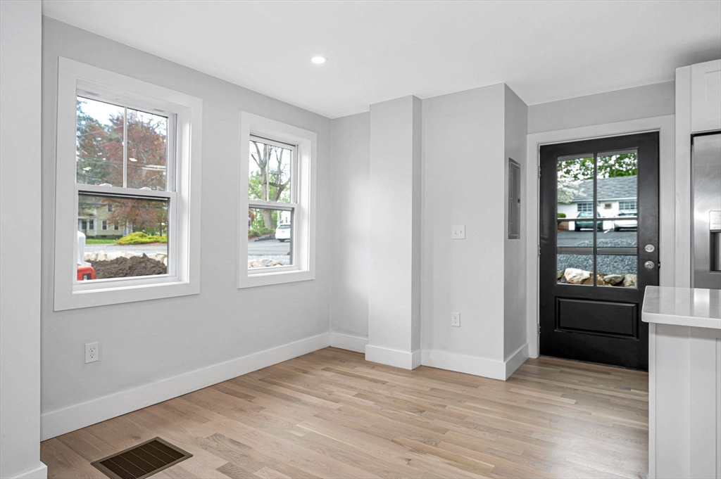 1514 Gorham Street, Unit 4 Lowell, MA 01852 - Photo 7 of 42 a view of empty room with wooden floor and windows
