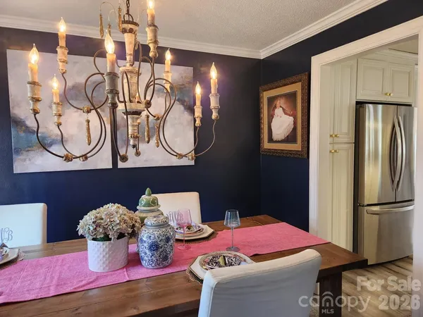 a bedroom with furniture and a mirror