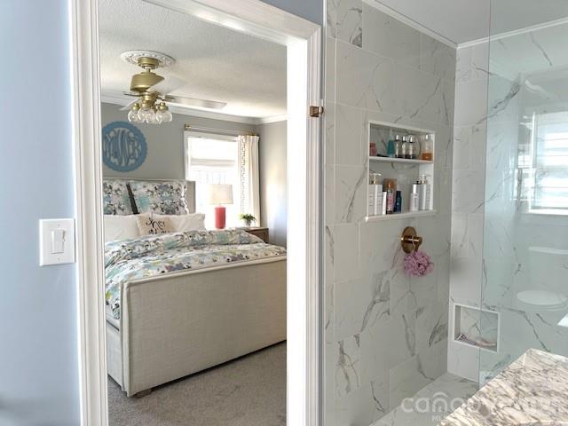 1414 Clark Place Lancaster, SC 29720 - Photo 23 of 41 a bathroom with a granite countertop sink a mirror and a shower