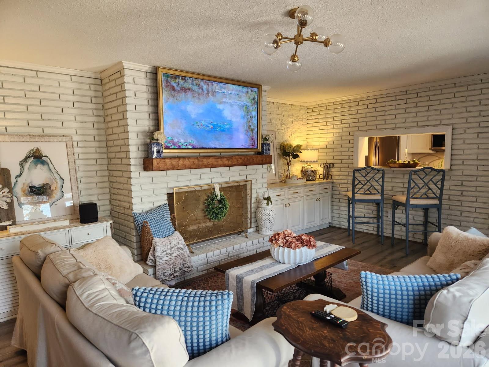 1414 Clark Place Lancaster, SC 29720 - Photo 9 of 41 a living room with furniture a flat screen tv and a fireplace