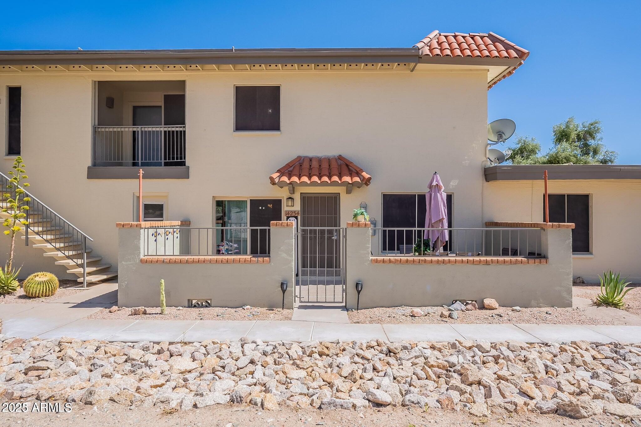 14234 North Oakwood Lane, Unit C Fountain Hills, AZ 85268 - Photo 1 of 22 a front view of a house