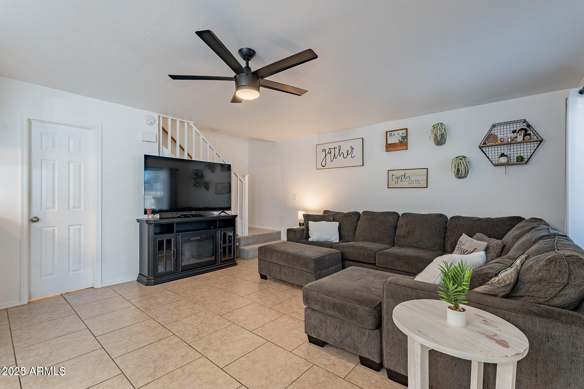14234 North Oakwood Lane, Unit C Fountain Hills, AZ 85268 - Photo 12 of 22 a living room with furniture and a flat screen tv