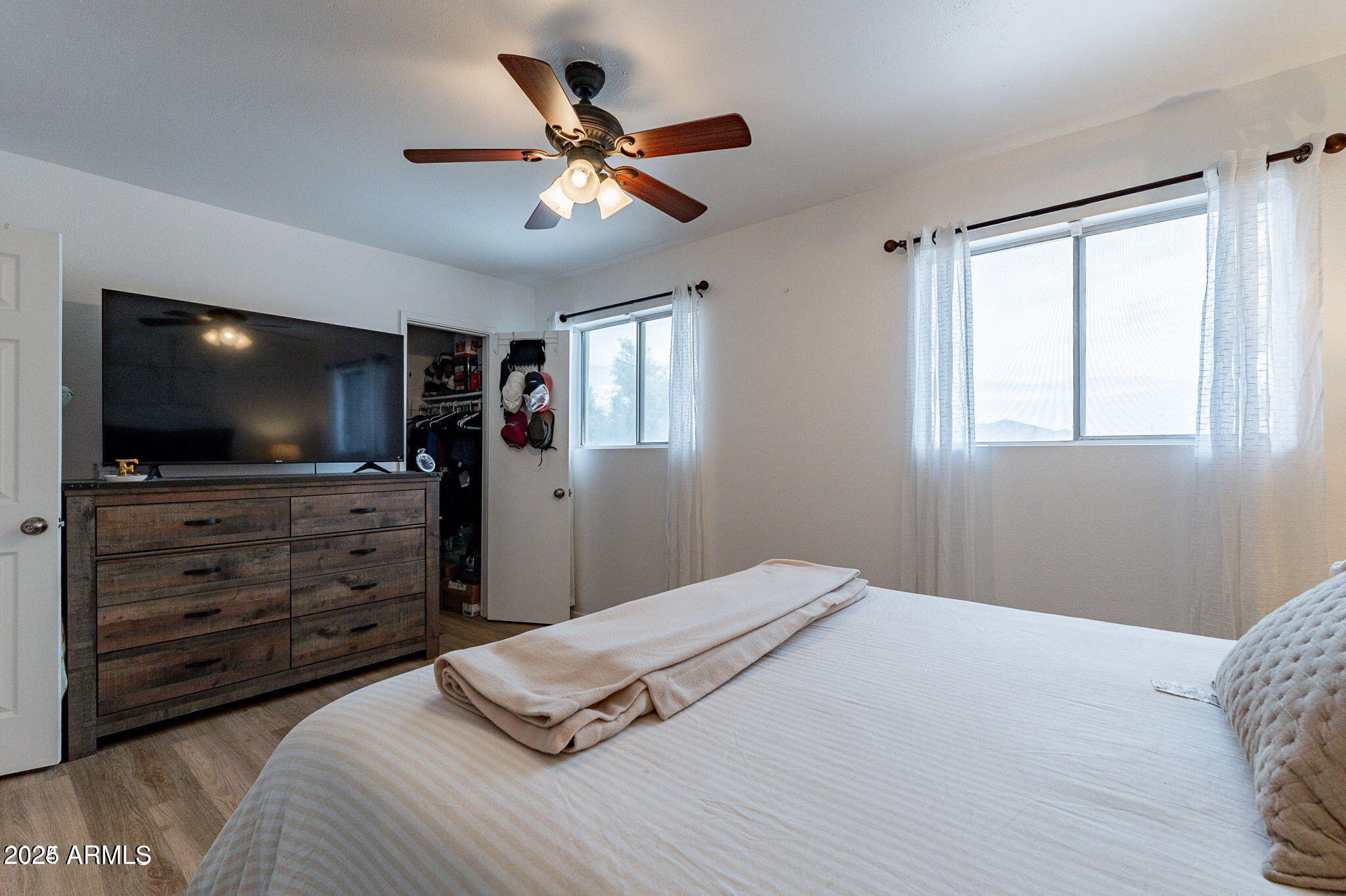 14234 North Oakwood Lane, Unit C Fountain Hills, AZ 85268 - Photo 15 of 22 a bedroom with a bed and a flat screen tv