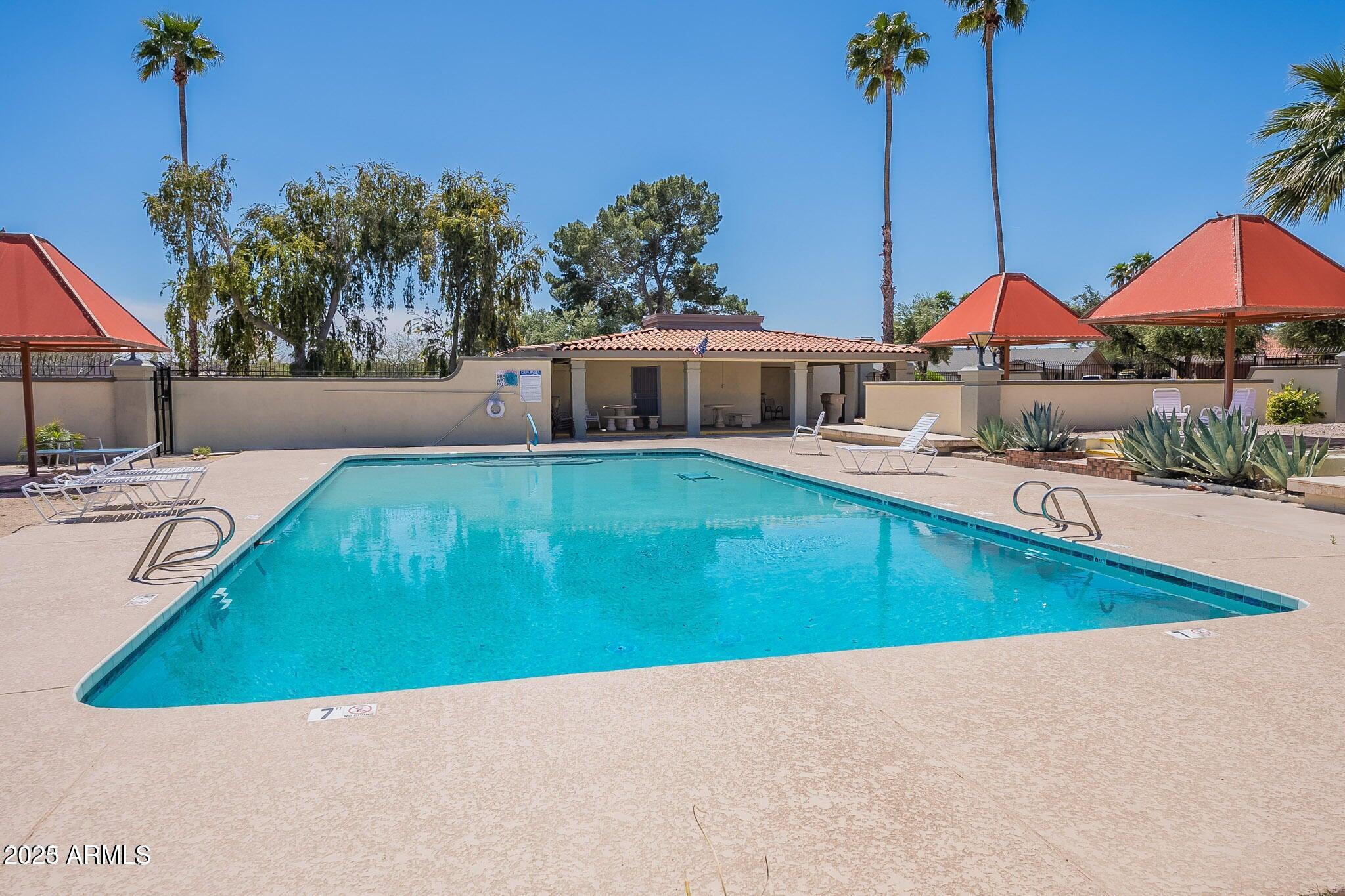 14234 North Oakwood Lane, Unit C Fountain Hills, AZ 85268 - Photo 16 of 22 a view of a house with a swimming pool
